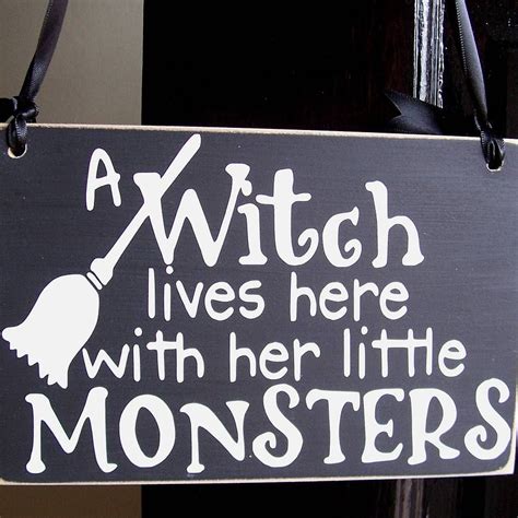 Beware A maleficent witch lives here sign